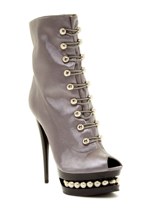 Gray satin ankle boot with a 6" shaft, open toe, 4" heel, and silver decorative lacing and pearls on the platform.